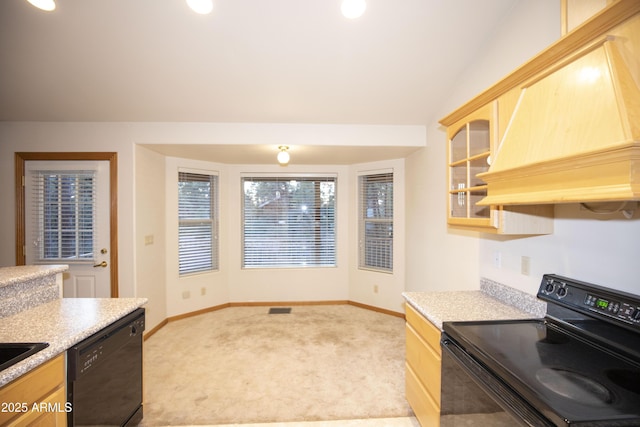 kitchen with black appliances, custom exhaust hood, light brown cabinets, and light colored carpet