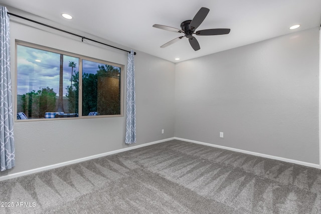 carpeted spare room with recessed lighting, baseboards, and a ceiling fan