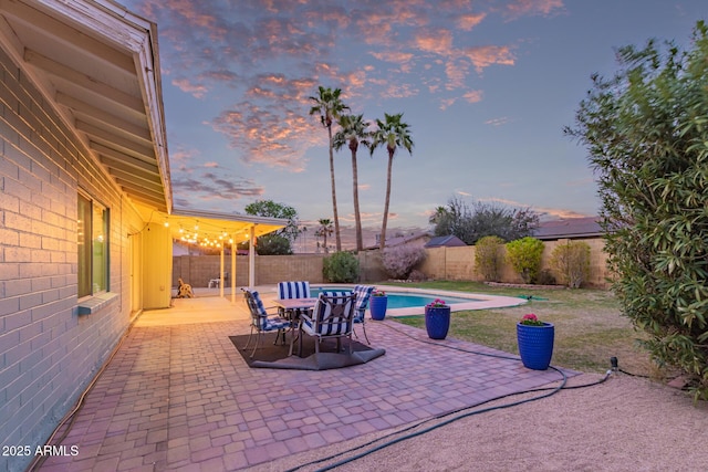 view of patio featuring a fenced in pool and a fenced backyard