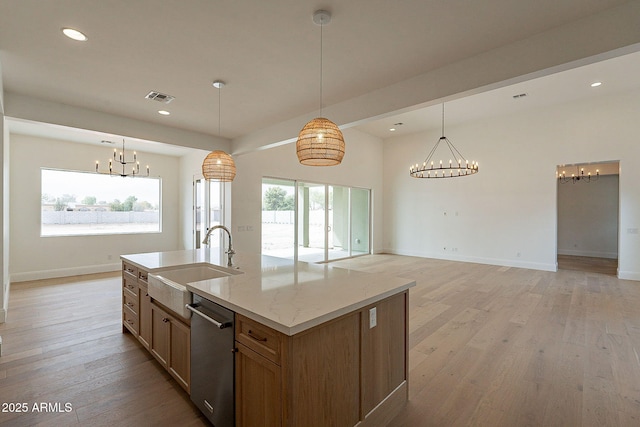 6832 N 178th Ln, Waddell, AZ 85355 - kitchen with stainless steel dishwasher, a notable chandelier, visible vents, and a sink