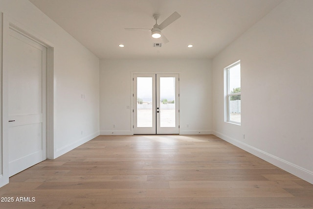 6832 N 178th Ln, Waddell, AZ 85355 - empty room featuring french doors, visible vents, ceiling fan, and light wood finished floors
