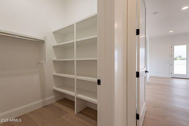 6832 N 178th Ln, Waddell, AZ 85355 - walk in closet with wood finished floors