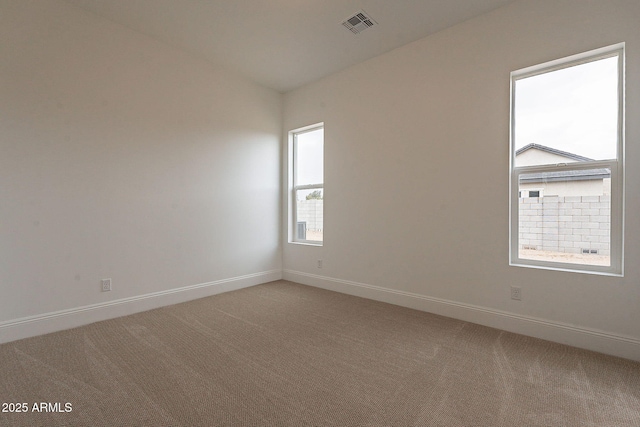6832 N 178th Ln, Waddell, AZ 85355 - empty room with visible vents, baseboards, and light colored carpet