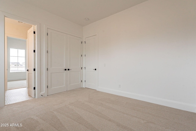 6832 N 178th Ln, Waddell, AZ 85355 - unfurnished bedroom featuring baseboards and light carpet