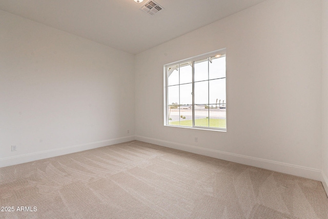 6832 N 178th Ln, Waddell, AZ 85355 - empty room with visible vents, light colored carpet, and baseboards