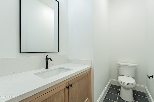 6832 N 178th Ln, Waddell, AZ 85355 - half bathroom featuring vanity, tile patterned floors, toilet, and baseboards