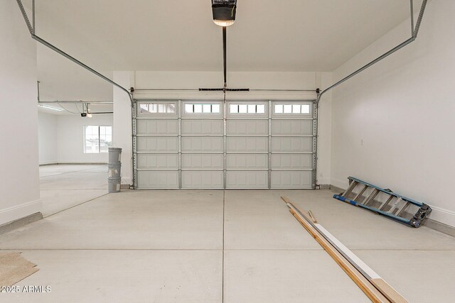 6832 N 178th Ln, Waddell, AZ 85355 - garage featuring baseboards and a garage door opener