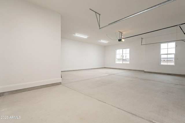 6832 N 178th Ln, Waddell, AZ 85355 - garage featuring a garage door opener and baseboards