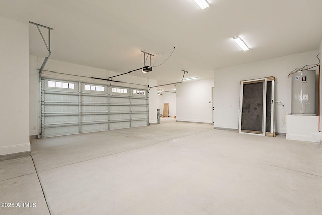 6832 N 178th Ln, Waddell, AZ 85355 - garage with a garage door opener, baseboards, and electric water heater