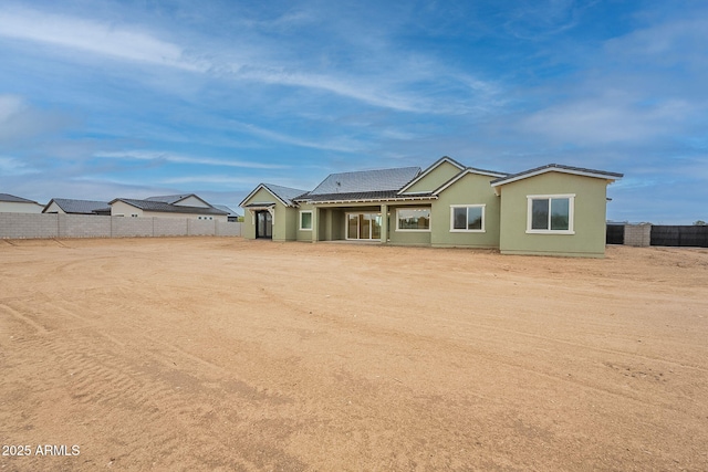 6832 N 178th Ln, Waddell, AZ 85355 - view of front facade featuring stucco siding and fence