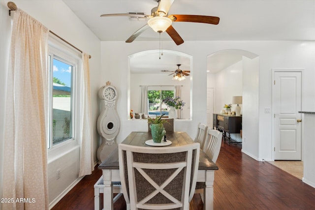 1924 S Rome St, Gilbert, AZ 85295 - dining space with arched walkways, a ceiling fan, wood finished floors, and baseboards