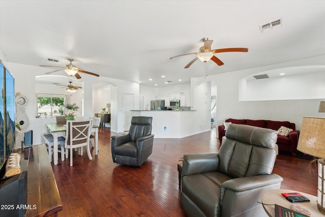 1924 S Rome St, Gilbert, AZ 85295 - living room featuring a ceiling fan, arched walkways, wood finished floors, and recessed lighting