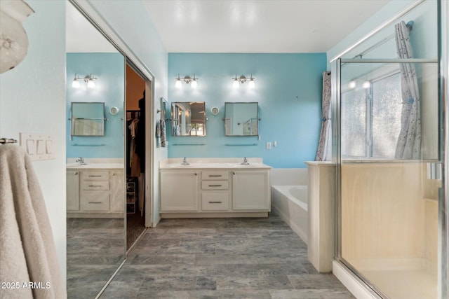 1924 S Rome St, Gilbert, AZ 85295 - full bath with a shower stall, double vanity, a walk in closet, and a garden tub