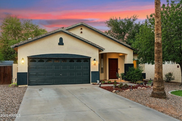 1924 S Rome St, Gilbert, AZ 85295 - view of front of home featuring stucco siding, driveway, and a garage