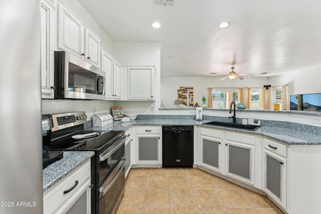 1924 S Rome St, Gilbert, AZ 85295 - kitchen with stainless steel appliances, a sink, light stone countertops, ceiling fan, and white cabinetry