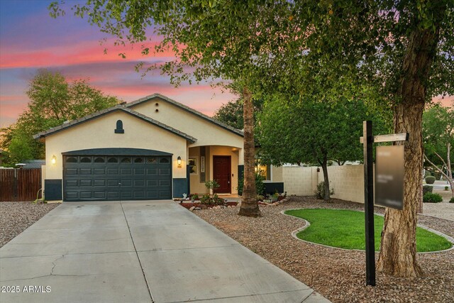 1924 S Rome St, Gilbert, AZ 85295 - view of front of home with stucco siding, driveway, and a garage