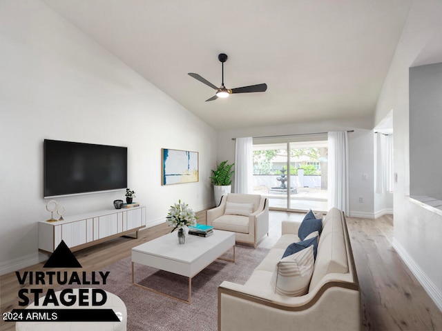 living room with high vaulted ceiling, ceiling fan, and light hardwood / wood-style flooring