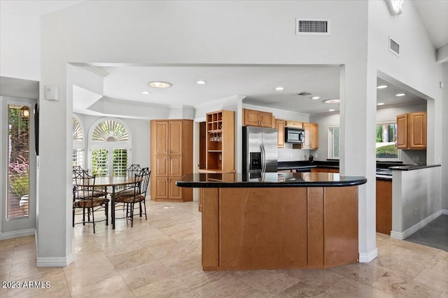 kitchen featuring stainless steel fridge with ice dispenser, crown molding, and kitchen peninsula