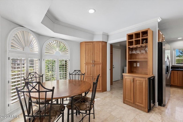 dining area featuring ornamental molding