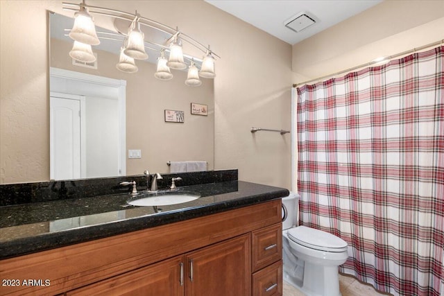 bathroom with vanity, toilet, and a shower with shower curtain