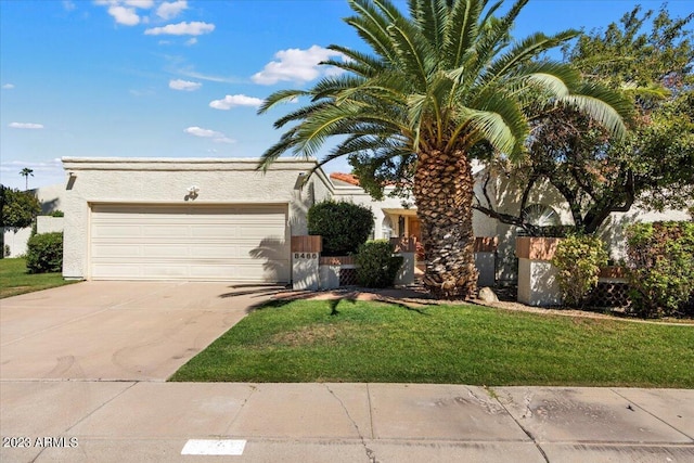 view of front facade featuring a garage and a front yard