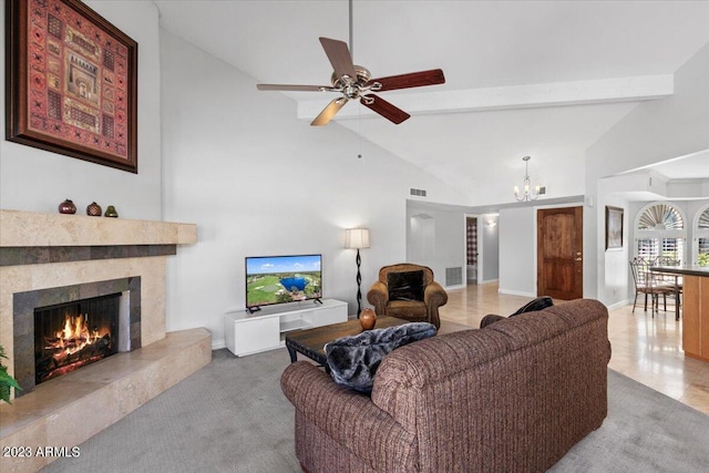 living room featuring light colored carpet, ceiling fan with notable chandelier, and lofted ceiling with beams