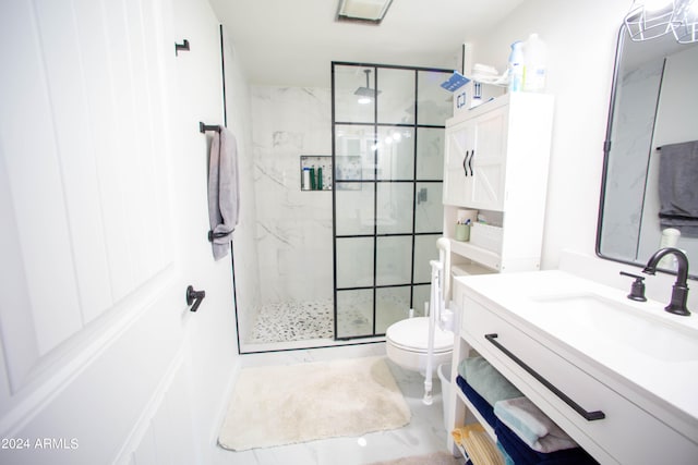 bathroom with vanity, a shower with shower door, and toilet