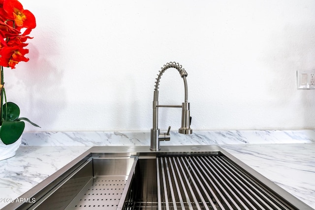 room details featuring stainless steel counters and sink