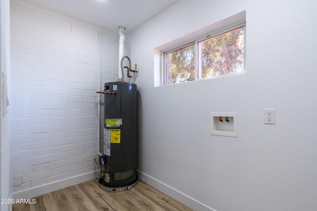 utility room featuring gas water heater