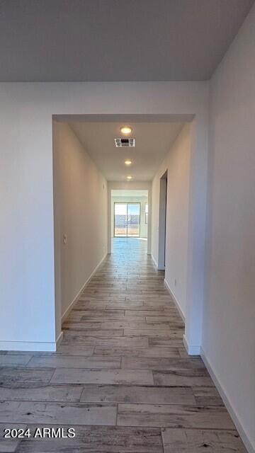 hall with light wood-type flooring