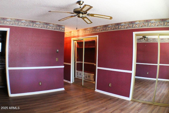 empty room with hardwood / wood-style floors, a textured ceiling, and ceiling fan