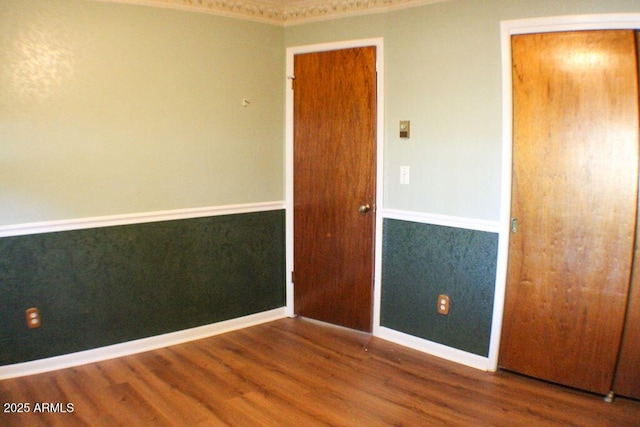 unfurnished room featuring hardwood / wood-style flooring