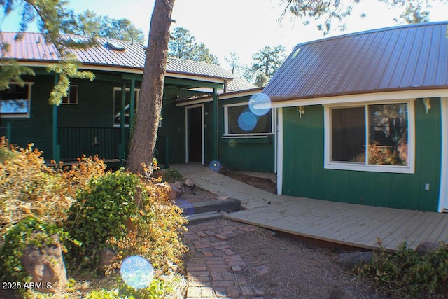 property entrance with a wooden deck