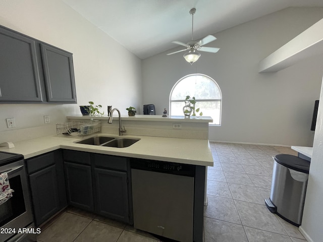 kitchen featuring sink, vaulted ceiling, light tile patterned floors, kitchen peninsula, and stainless steel appliances