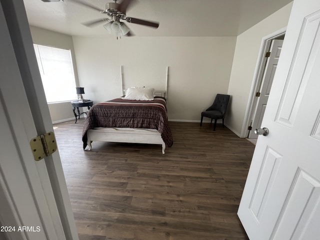 bedroom featuring ceiling fan and dark hardwood / wood-style floors