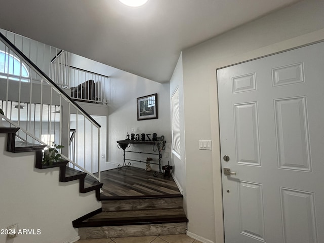 stairway featuring tile patterned floors