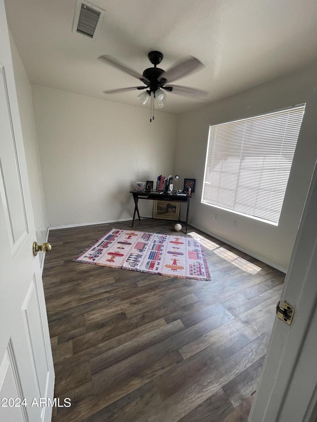 office space with dark hardwood / wood-style floors and ceiling fan