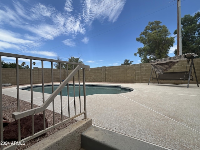 view of pool featuring a patio area