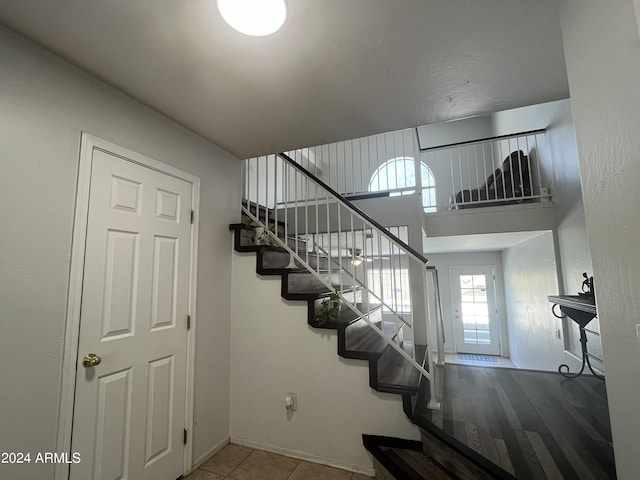 stairs with tile patterned flooring