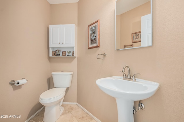 2535 N Pinnule Cir, Mesa, AZ 85215 - bathroom featuring toilet, tile patterned floors, baseboards, and a sink