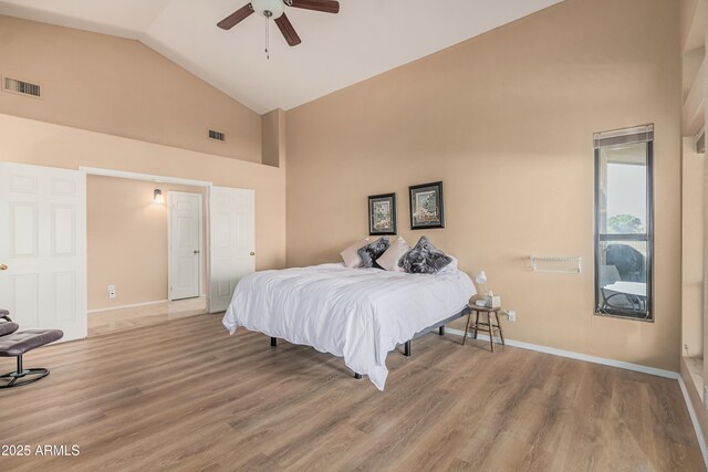 2535 N Pinnule Cir, Mesa, AZ 85215 - bedroom with high vaulted ceiling, wood finished floors, baseboards, and a ceiling fan