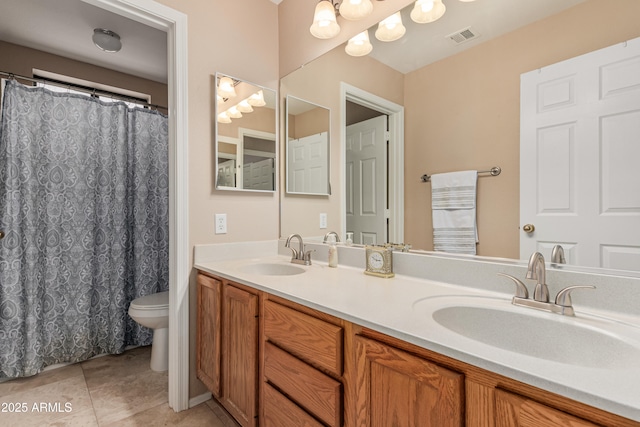 2535 N Pinnule Cir, Mesa, AZ 85215 - full bathroom featuring toilet, double vanity, and tile patterned floors
