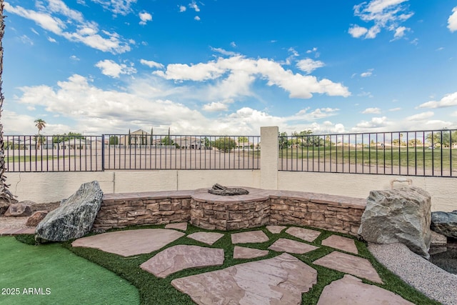 2535 N Pinnule Cir, Mesa, AZ 85215 - view of patio featuring fence and a fire pit