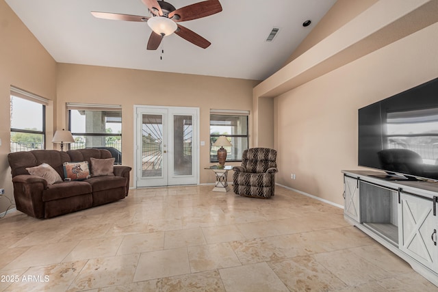 2535 N Pinnule Cir, Mesa, AZ 85215 - living area featuring french doors, healthy amount of natural light, ceiling fan, baseboards, and vaulted ceiling