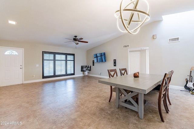 dining room featuring vaulted ceiling and ceiling fan with notable chandelier