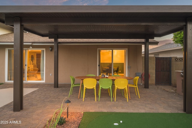 view of patio terrace at dusk