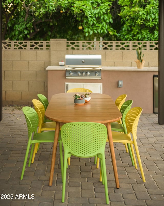 view of patio with a grill and exterior kitchen