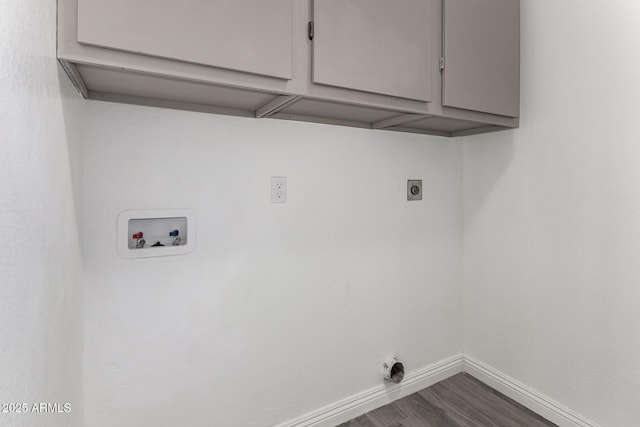 laundry room with washer hookup, hookup for an electric dryer, baseboards, cabinet space, and dark wood-style flooring