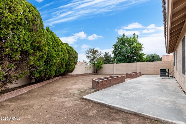 view of patio / terrace featuring central AC unit and a fenced backyard