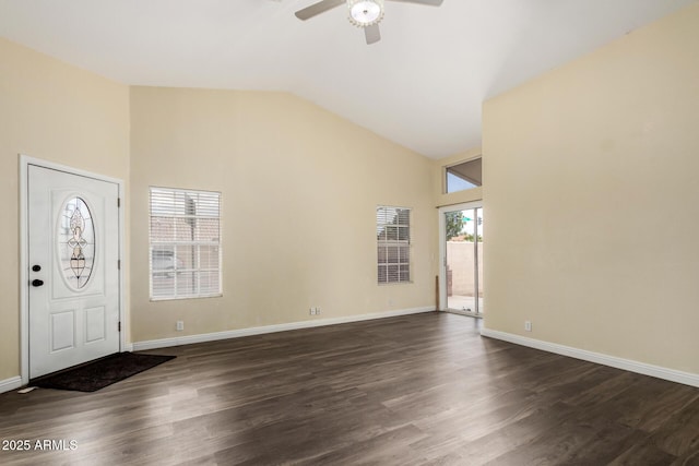 foyer featuring dark wood-style floors, high vaulted ceiling, baseboards, and a ceiling fan